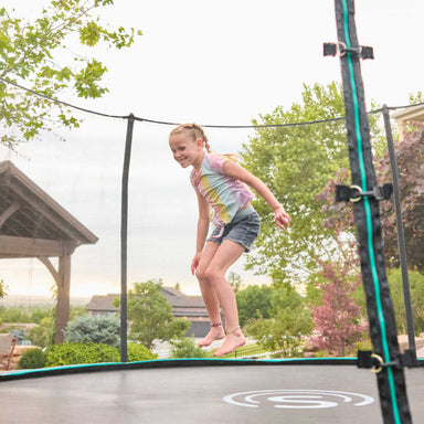 15" Round Trampoline with girl jumping in a yard