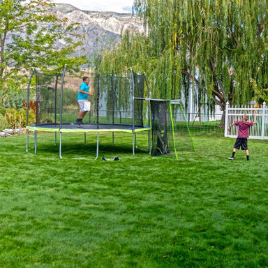 15' x 13' Oval Trampoline with Sports Net - Dual Color with kids playing
