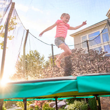 15' x 9' Signature Series Rectangle Trampoline with girl jumping