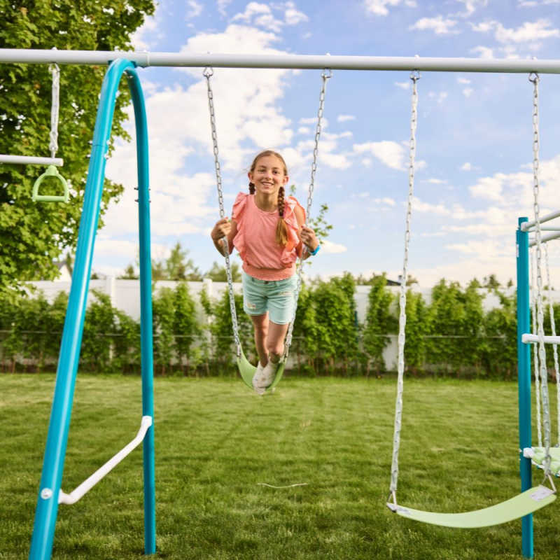 ActivPlay Base Camp Jungle Gym with girl swinging in backyard