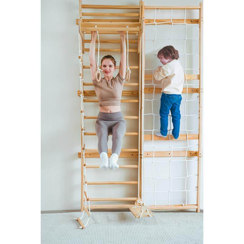 Avenlur Neem Swedish Wall Ladder Front View Showing A Woman Doing Pull Up With Legs Up