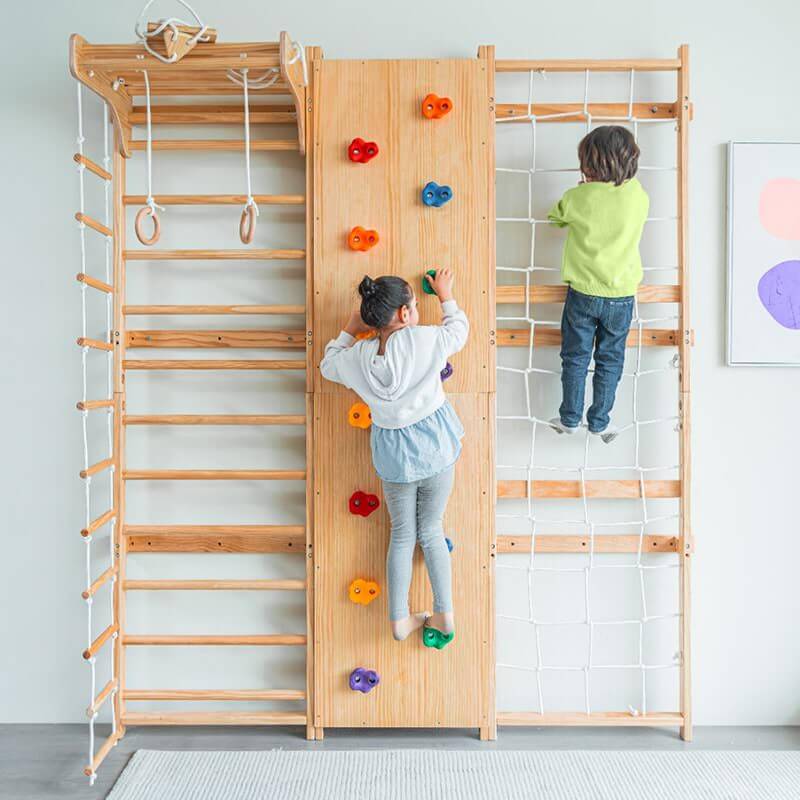 Avenlur Walnut - 9-in-1 Swedish Ladder Wall Gym Set Front View Kids Climbing The Rockwall And Rope Wall