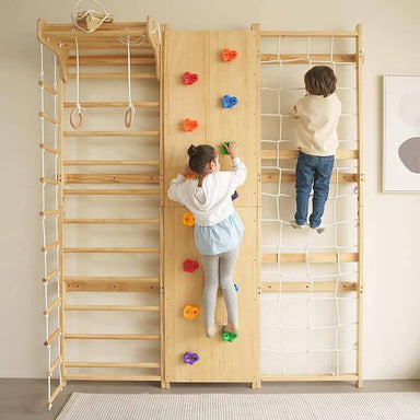 Avenlur Walnut - 9-in-1 Swedish Ladder Wall Gym Set Front View Showing A Kid Climbing The Rope Wall And rock Wall