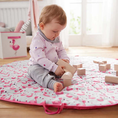 Baby Playing The HABA USA Basic Building Blocks 60 Piece Large Starter Set On The Mat Front View