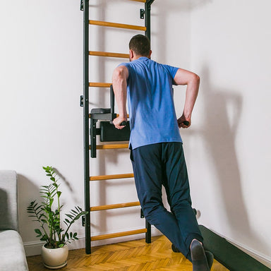 BenchK Dip Bar for Wall Bars DB1B with a man working on his triceps