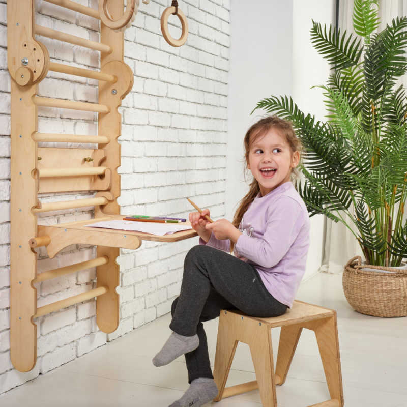 Goodevas 5 in 1: Wooden Swedish Wall Bar Set for Children with a girl using the desk