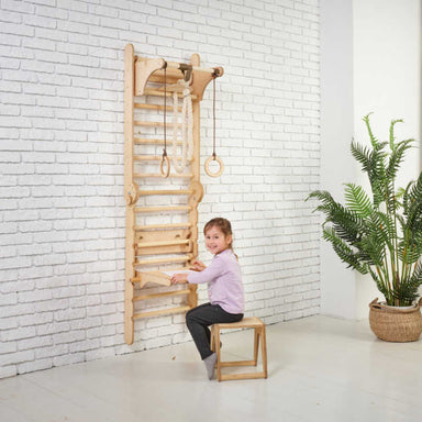 Goodevas 5 in 1: Wooden Swedish Wall Bar Set for Children with a girl at the desk