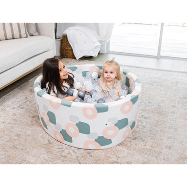 Little Big Playroom Ball Pit Boho Organic Shapes Ball Pit 100 Pearl and 100 Water Balls Front View 2 Kids Inside the Ball Pit Playing in Living Room Happy