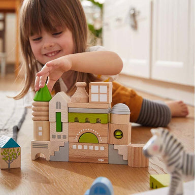 Little girl Enjoying Playing The HABA USA Coburg 28 Piece Wooden Building Blocks