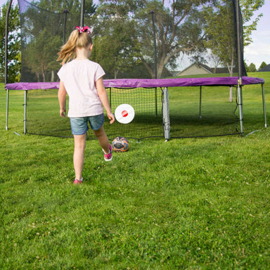 Skywalker Kickback Game accessory for trampolines swgm100 with Girl kicking a soccer ball