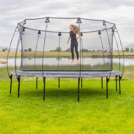 Skywalker Trampolines 14 foot Round Epic Series Trampoline - EPIC14D07 with girl jumping on it