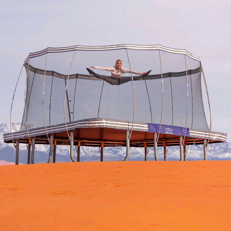 Skywalker Trampoline's 15' Premium Square Trampoline - LMG-SPTCS1515 - with girl jumping