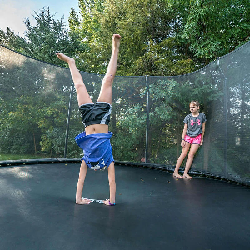 acon_air_14ft_round_trampoline_with_premium_net_package_handstanding