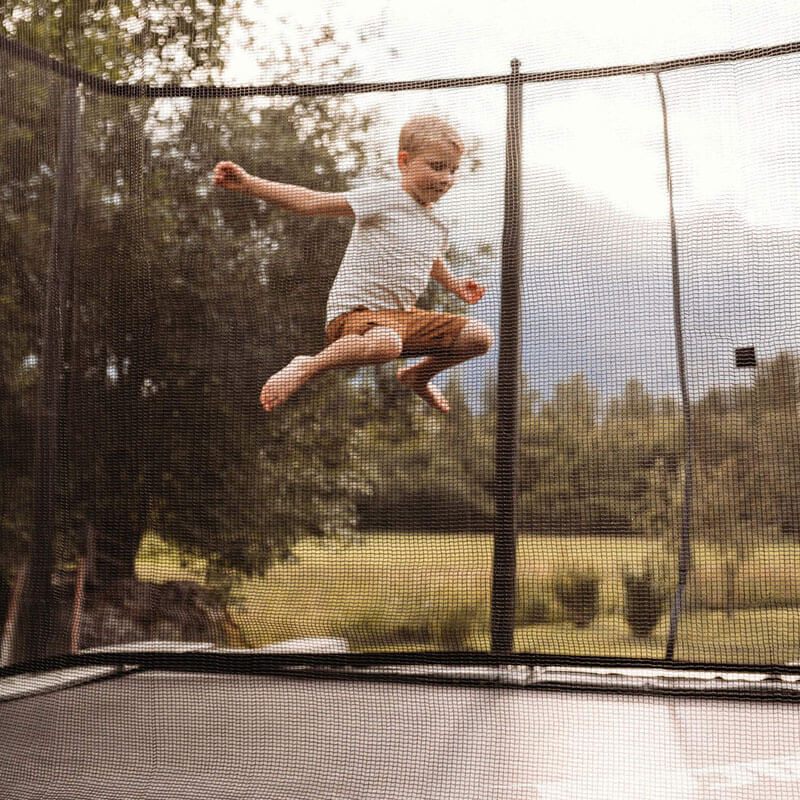 acon_air_16_sport_hd_rectangular_trampoline_package_boy_jumps