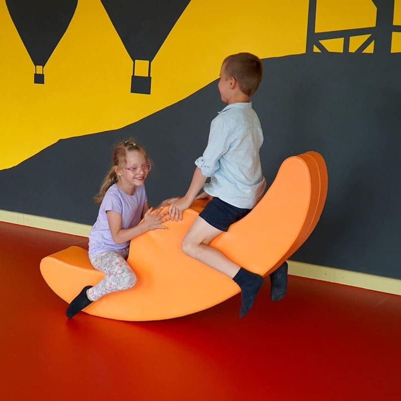 soft play rocker in orange with kids playing