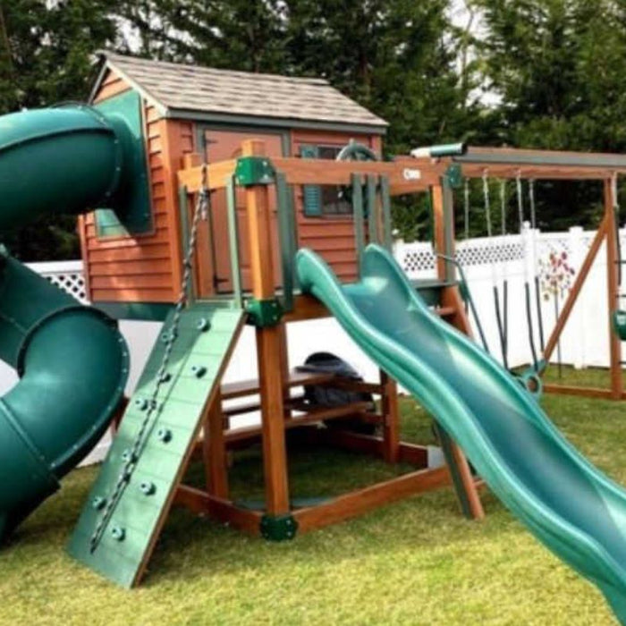 Kids Outdoor Playhouse In Wood grain and green in a yard