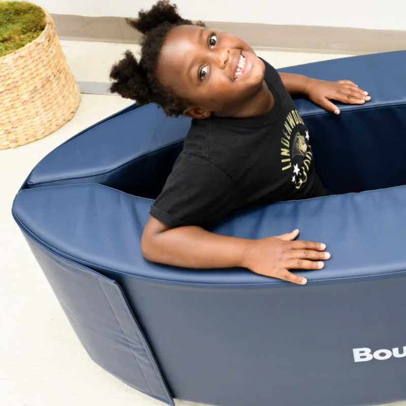 Child relaxing in the BouncyBand Soft Sensory Lounger