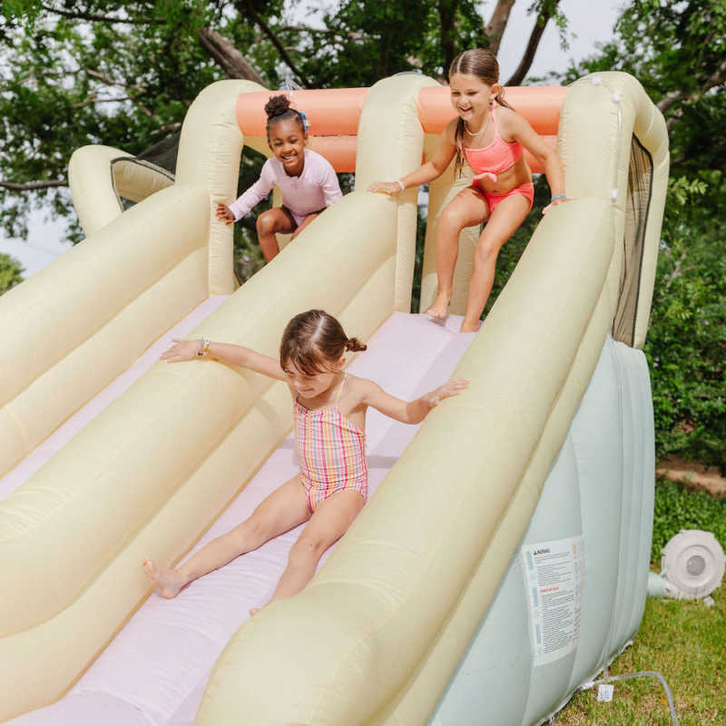 Inflatable water slide with girls playing 