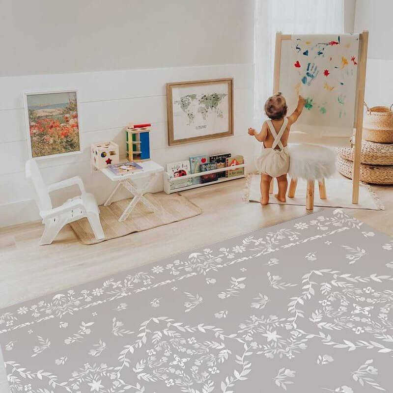 Shwally Playmat in a playroom with a girl painting