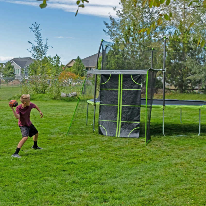 15' x 13' Oval Trampoline with Sports Net - Dual Color with boy throwing football
