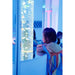 5ft Bubble Tube with Wall Mirror & Reflective Platform - child watching the illuminated bubble tube