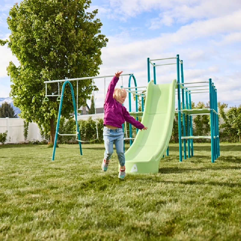 ActivPlay Base camp Jungle Gym with a girl playing in a backyard