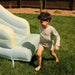 All-Star Sports Arena Bounce House with a boy by the slide
