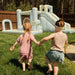 All-Star Sports Arena Bounce House with girls running towards it