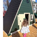 Vinyl Playhouse with slide in green with girl playing