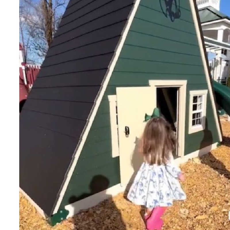 Vinyl Playhouse with slide in green with girl playing