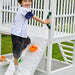 Avenlur Craftsman - Modern Backyard Outdoor Swing Set Showing A kid Climbing The Rockwall