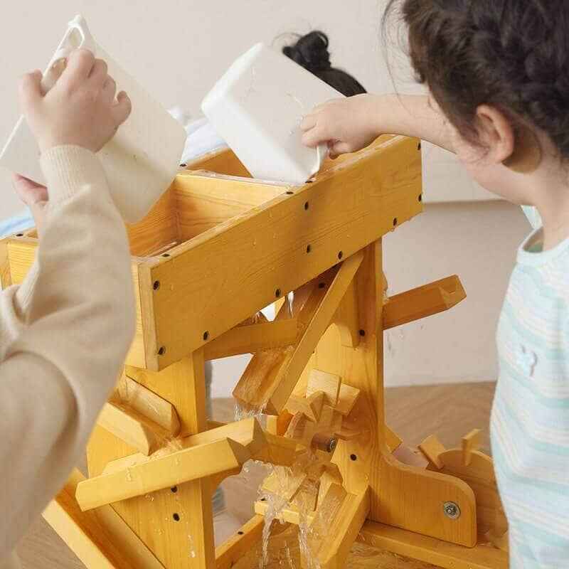 Avenlur Outdoor Wooden Water Table For Kids Toddlers Top Rear View Up Close Kids Pouring Water