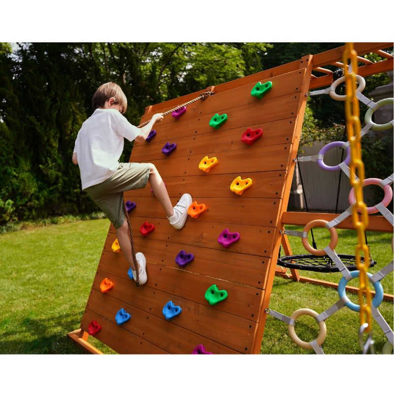 Avenlur Sycamore Wooden Climber and Swing with boy climbing wall