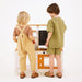 Avenlur Woodland Mud Kitchen – Montessori Outdoor Wooden Play Kitchen with 2 kids playing 