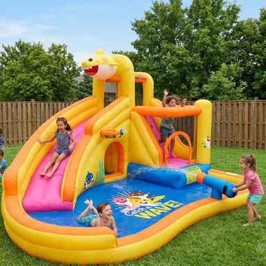 Baby Shark Inflatable Water Slide with Pool with kids playing in a yard
