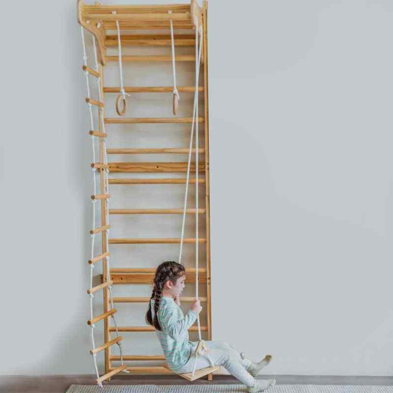 Avenlur Betula Swedish Wall Ladder with child swinging