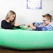 Kids using a mint green BouncyBand Comfy Hugging Peapod Large