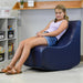 Girl relaxing in the BouncyBand Rocking Soft Sensory Chair