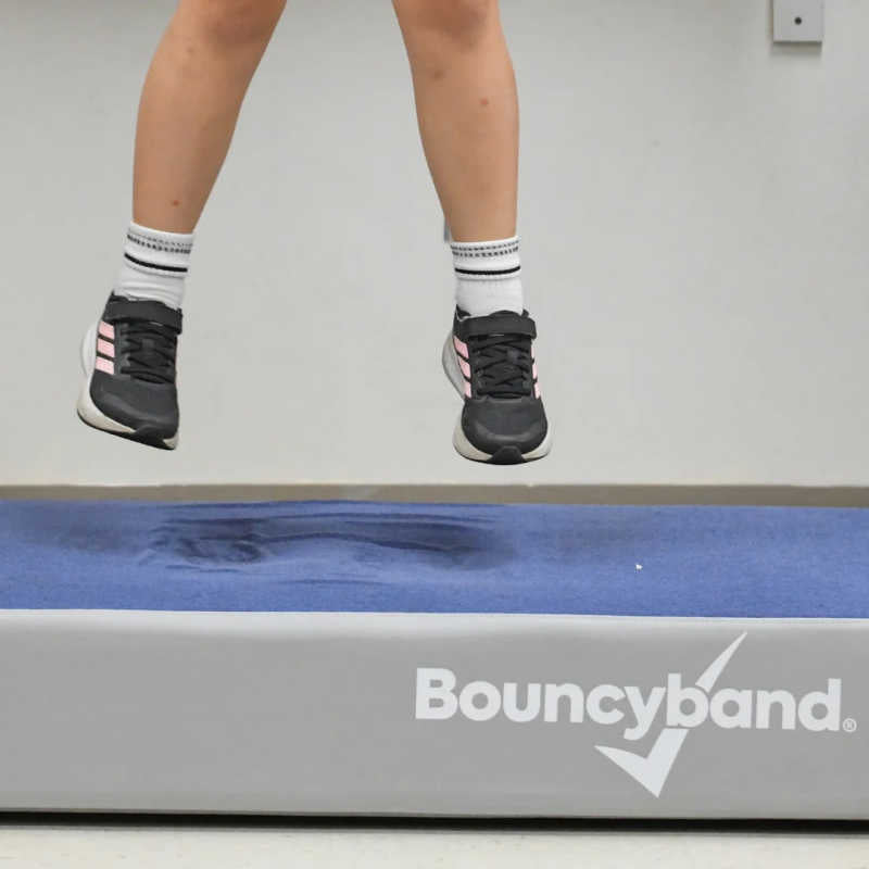 Child bouncing on the BouncyBand Bouncy Pad for sensory movement input