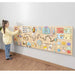 girl playing with sensory wall panel busy boar