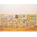 wooden sensory wall panel sitting on the ground