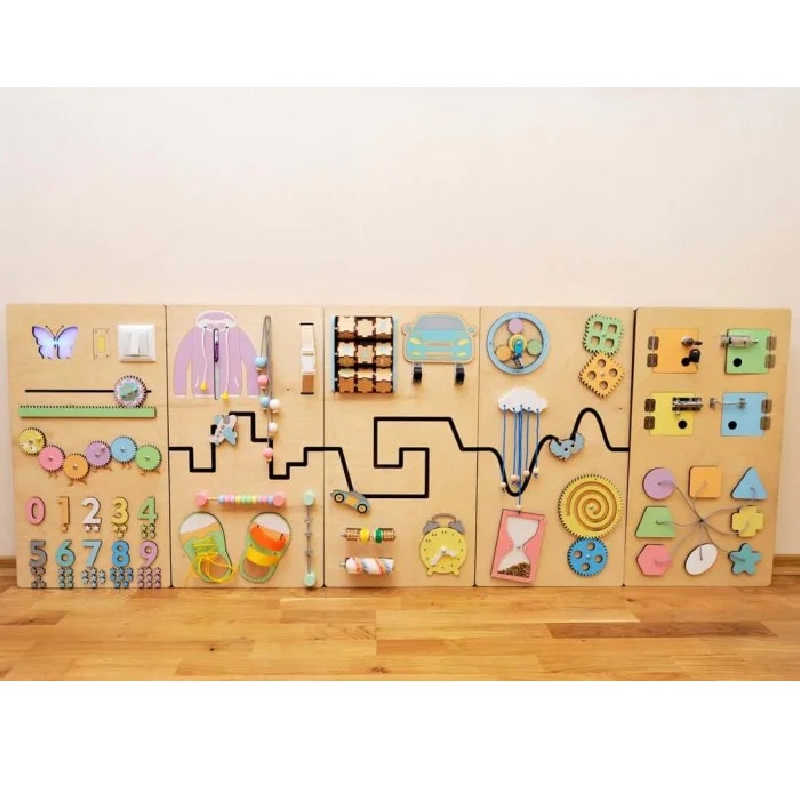 wooden sensory wall panel sitting on the ground