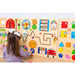 Montessori Play wall panel with sensory items and girl playing 