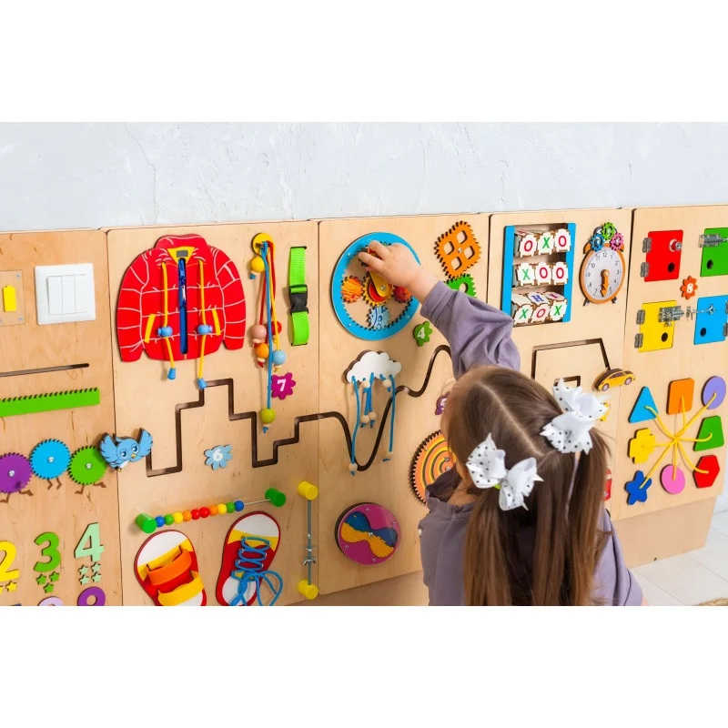 Bumblebeesmart montessori play wall panel with a girl 