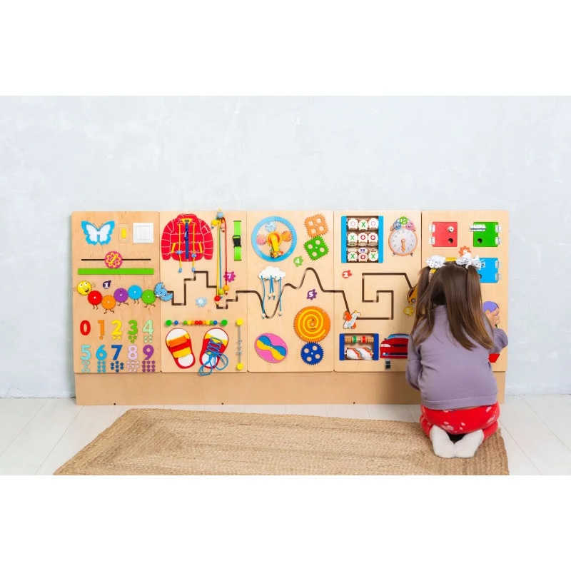 Bumblebeesmart Montessori Play Sensory wall panel with a girl