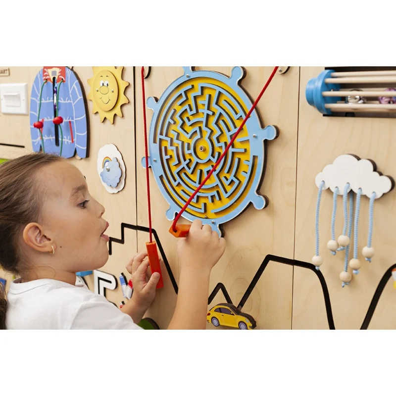 Sensory Wall Panel in spring colors with a girl playing with a maze