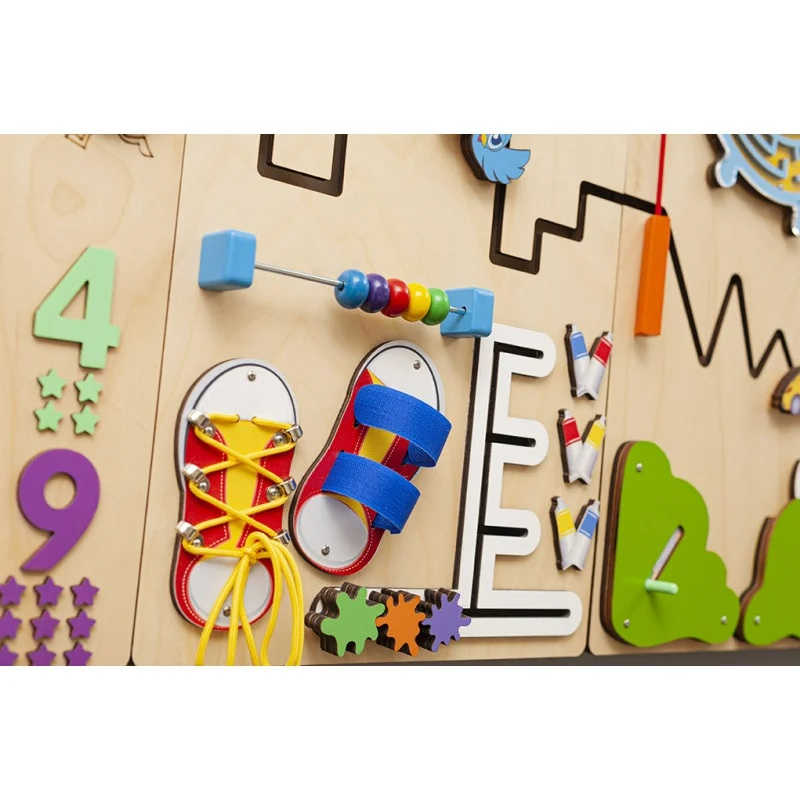 BumblebeeSmart Sensory Wall Panel in spring colors with shoes up close