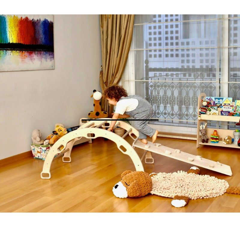 climbing arch rocker with a boy in a playroom