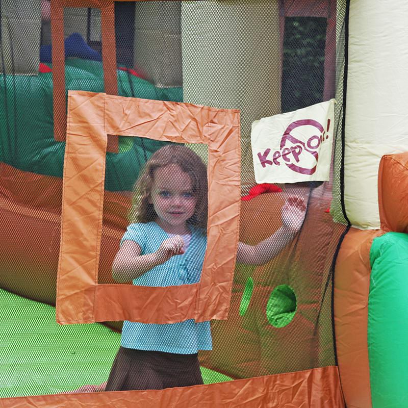 close-up-of-a-girl-in-the-window-of-kid-wise-clubhouse-climber-bounce-house