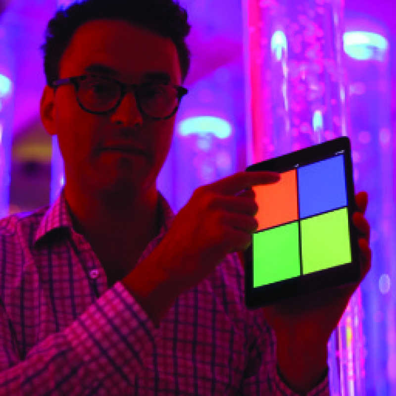 Combination wireless genie receiver app being used by a guy on a tablet.